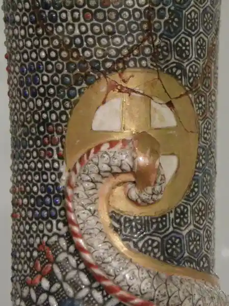 Gold solar cross with dotted background